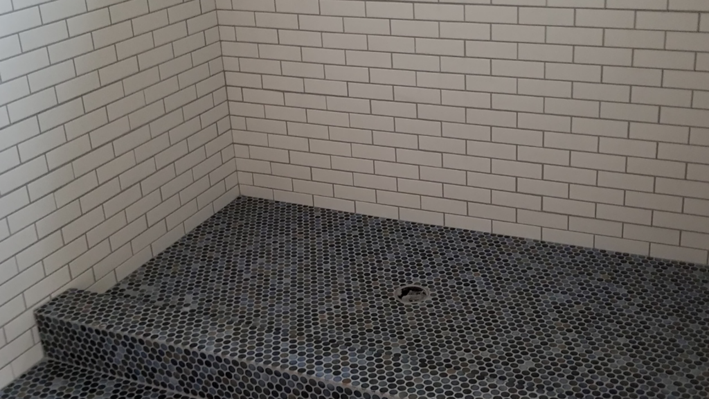 Custom tile design and installation for shower walls and floor